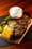 prato de carne com milho